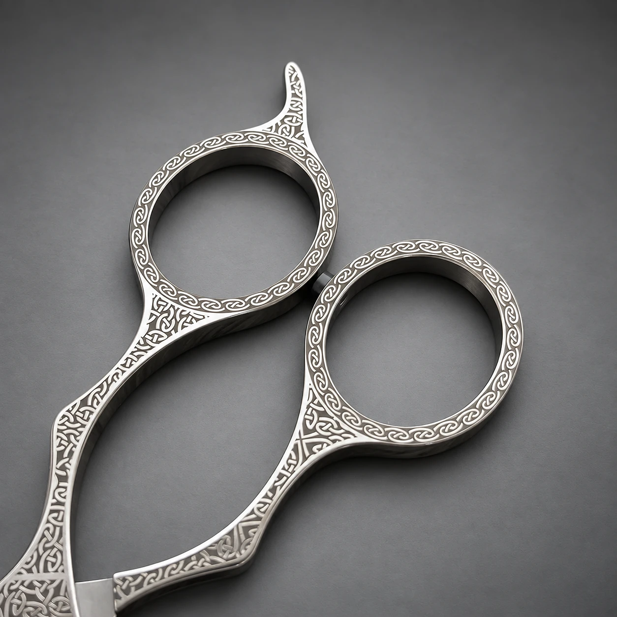 Celtic Knot scissors – finger rings close-up, continuous Celtic knot engraving on the handles