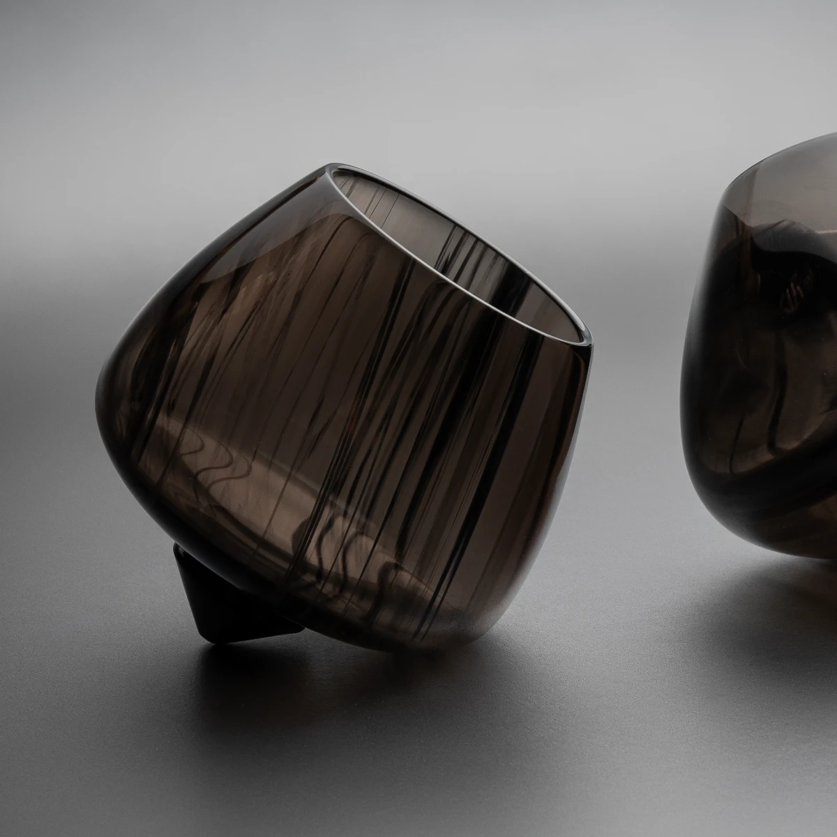 Rocking brandy glass — rounded base detail, obsidian rocking glass