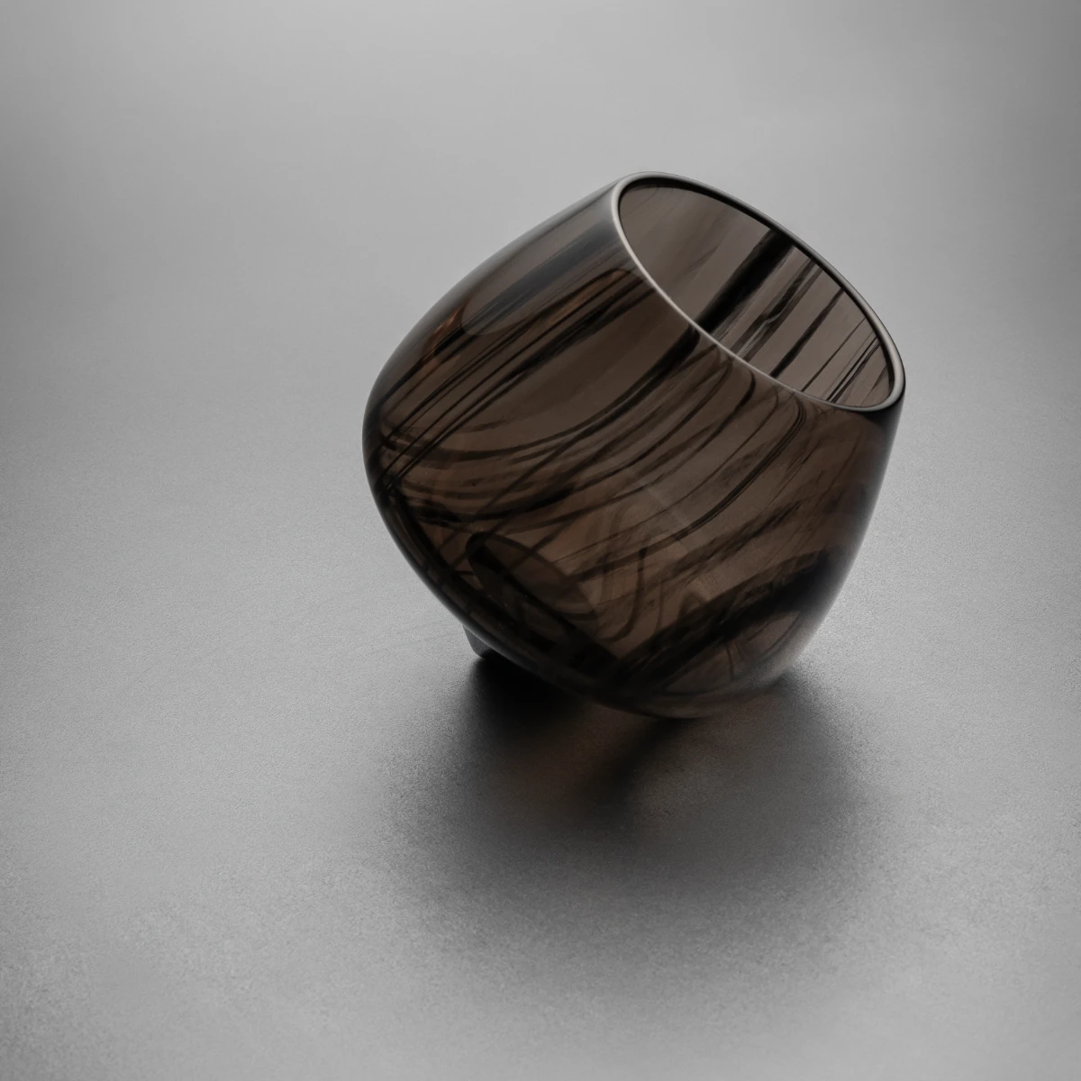 Rocking brandy glass — top view, semi-translucent obsidian