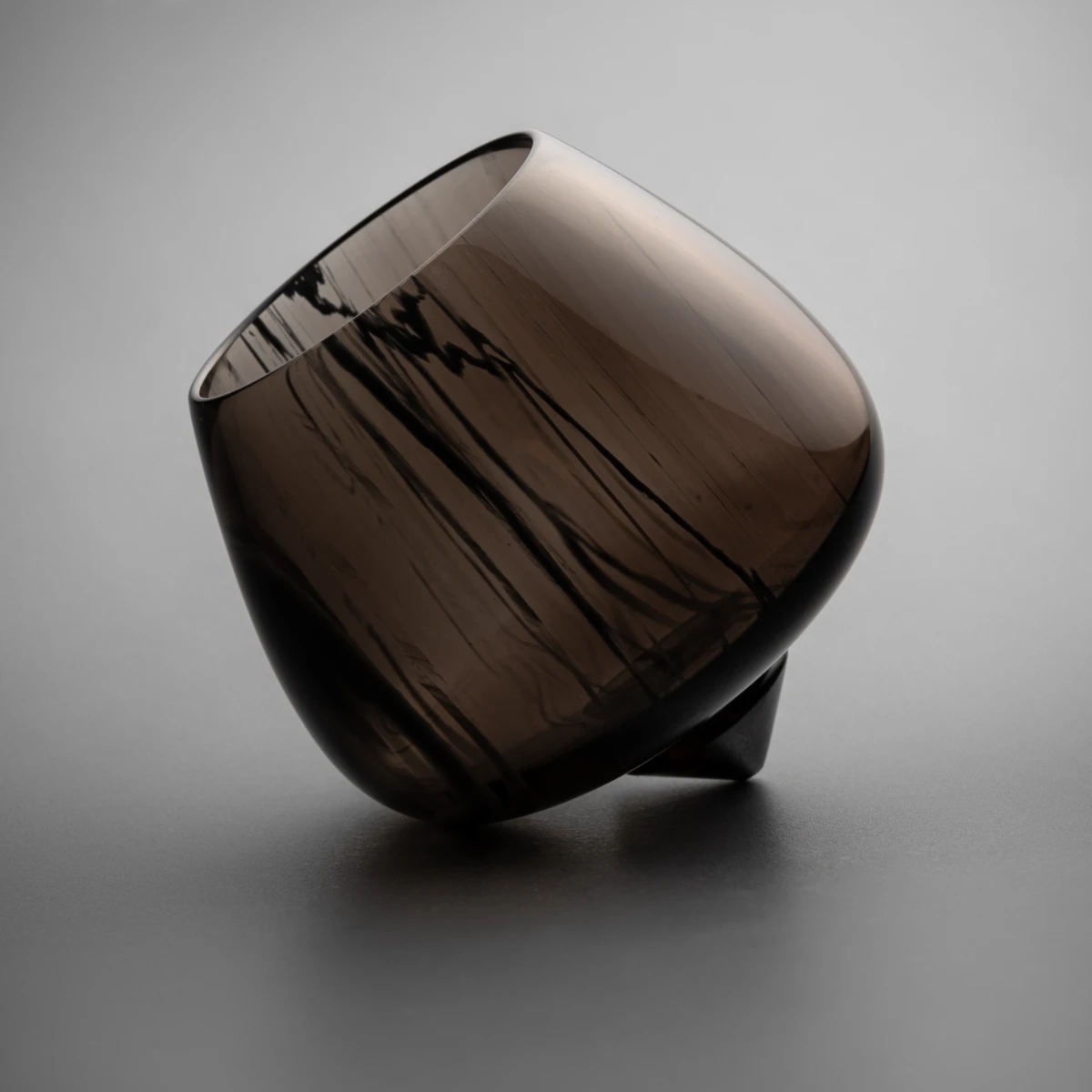 Obsidian rocking brandy glasses — pair in semi-translucent volcanic stone