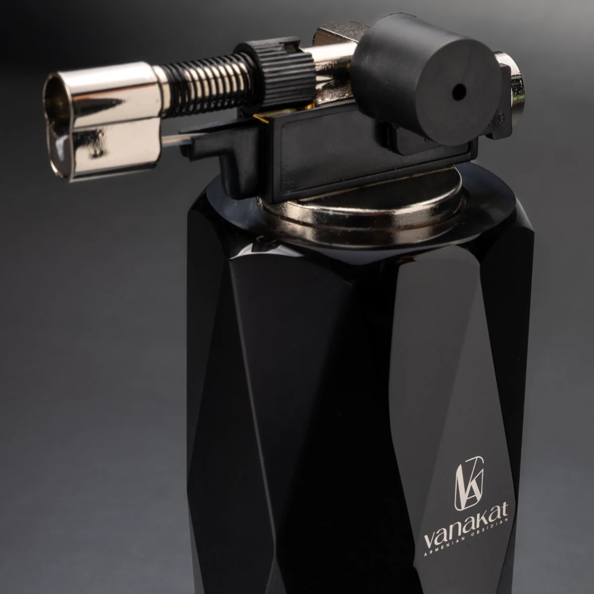 Bristol Lighter — gemstone-cut obsidian body, jet torch at crown