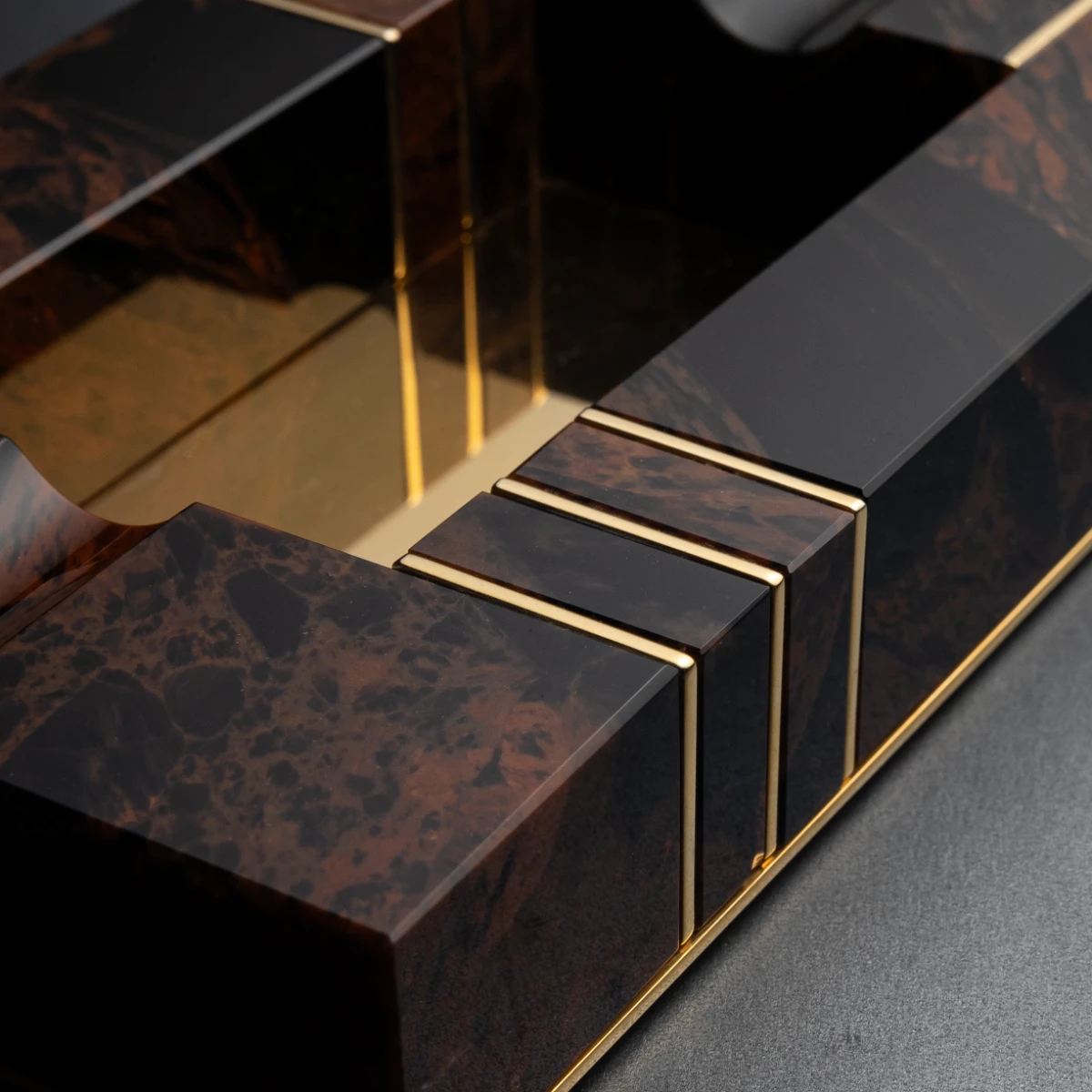 Brown & Gold ashtray — side profile, gold and obsidian contrast