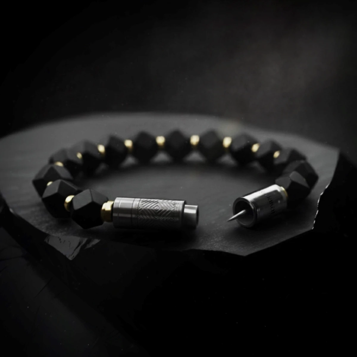 Bracelet cigar punch — bespoke obsidian cigar accessory