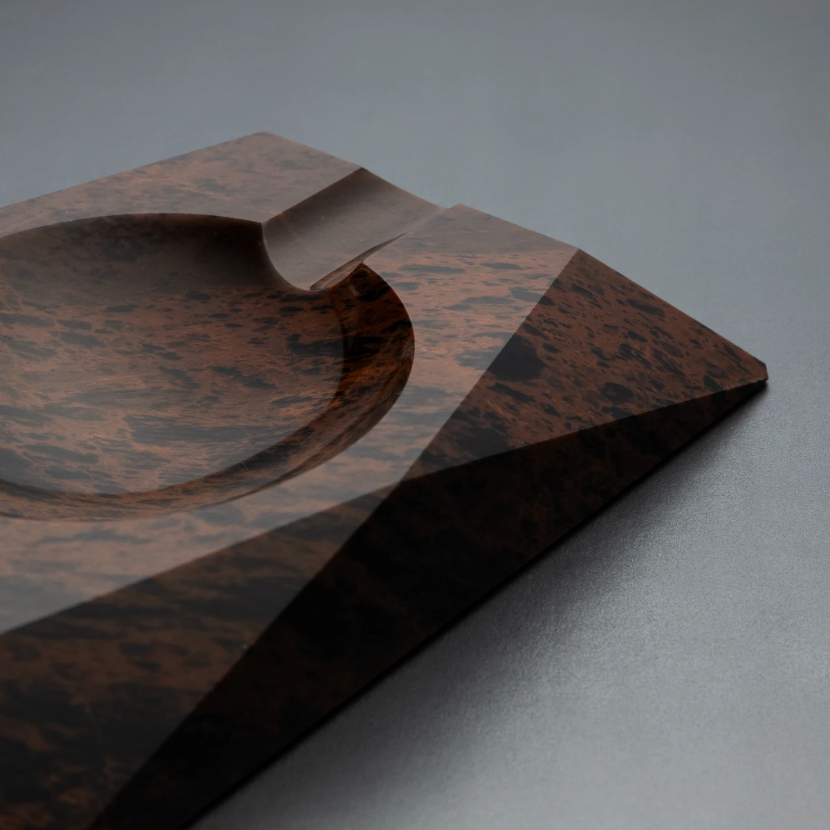 Eclipse ashtray — mirror-polished interior, raw exterior contrast