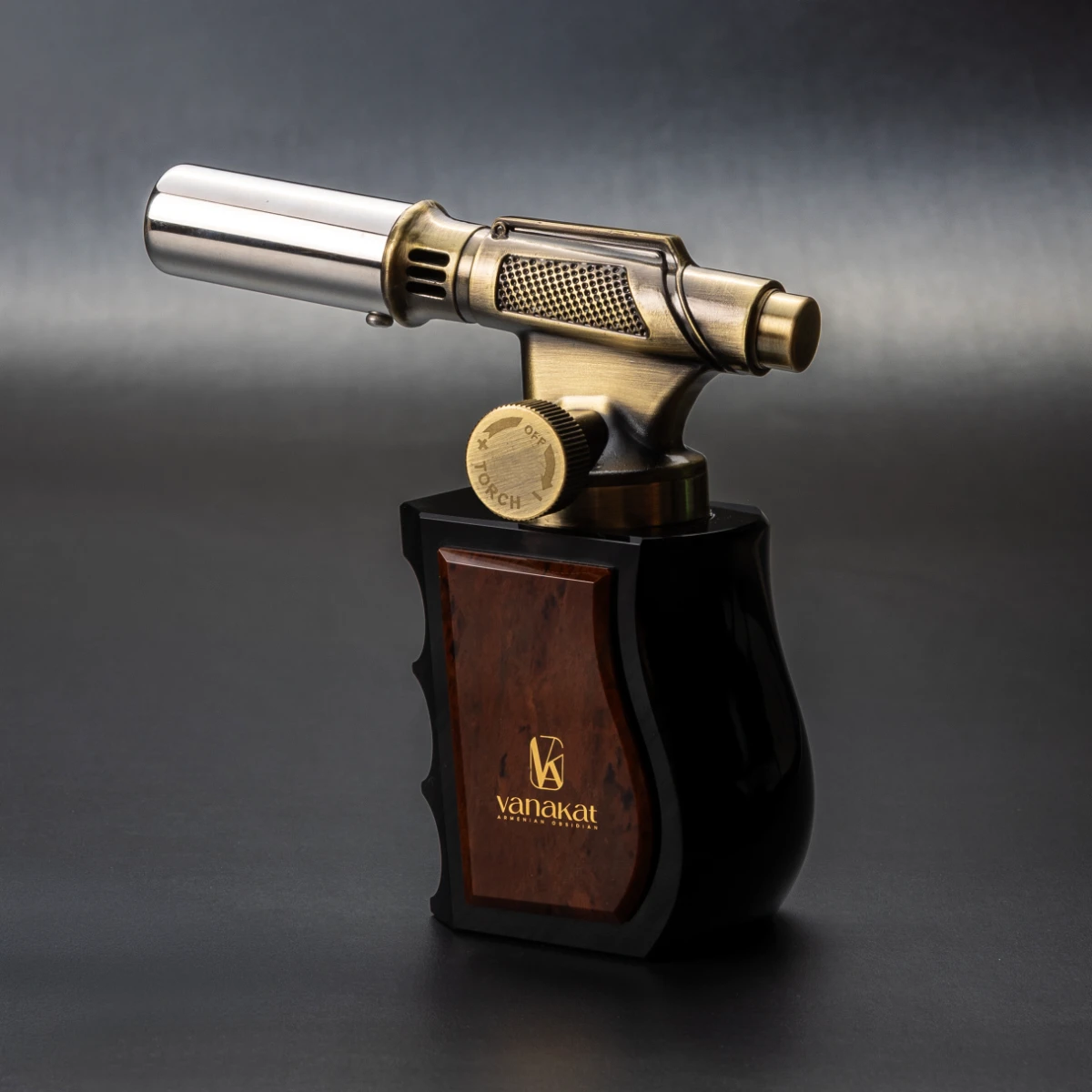 Gun Lighter — miniature gun-form brass cigar lighter on Jet Black and Brown Burl obsidian base