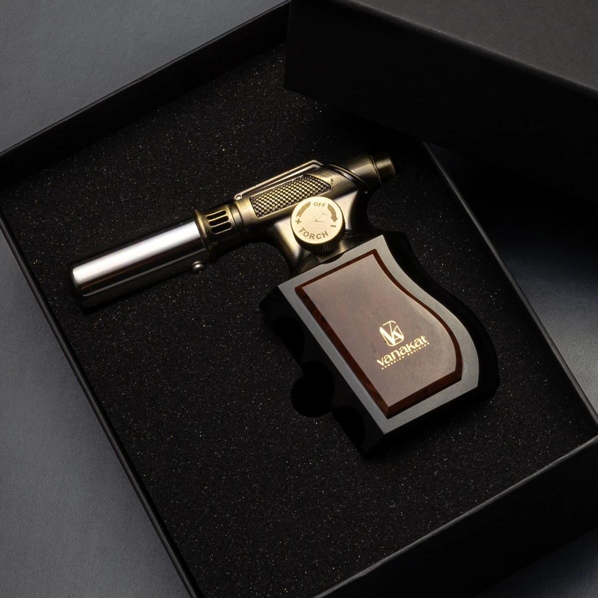 Gun Lighter — side profile, brass and obsidian collector's piece
