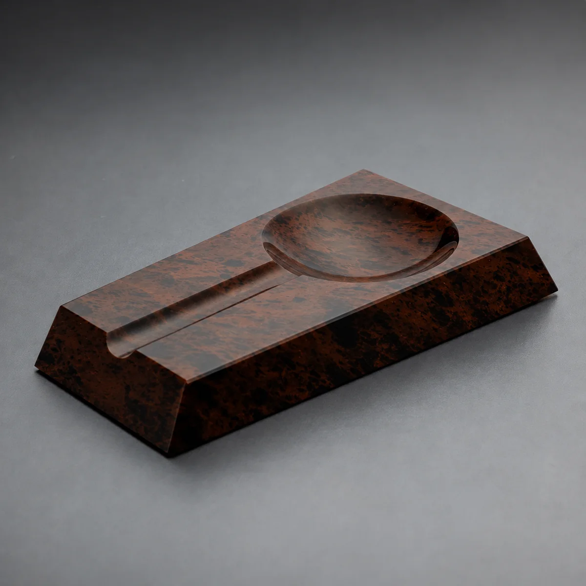 Loupe Brown obsidian cigar ashtray – jeweller's loupe form, mirror-polished, warm mottled stone