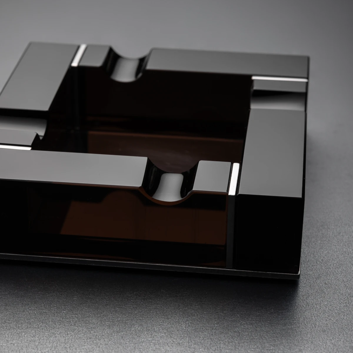 Noir ashtray — star form detail, angled obsidian panels