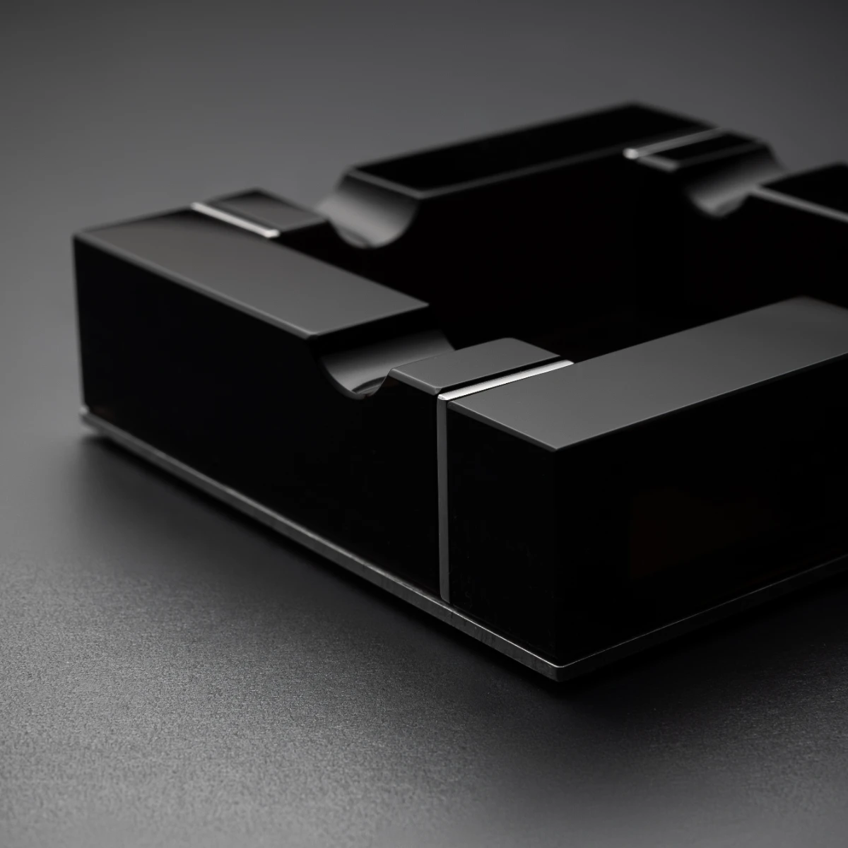 Noir ashtray — nickel-plated steel base, four volcanic stone panels