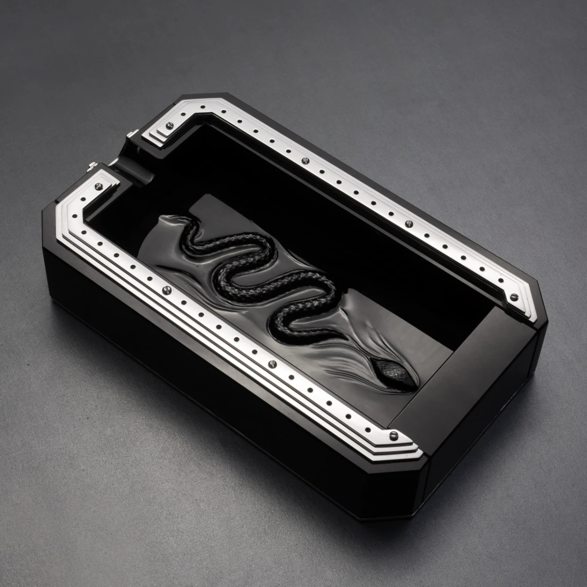 Obscura obsidian ashtray — hand-sculpted snake in Jet Black volcanic stone