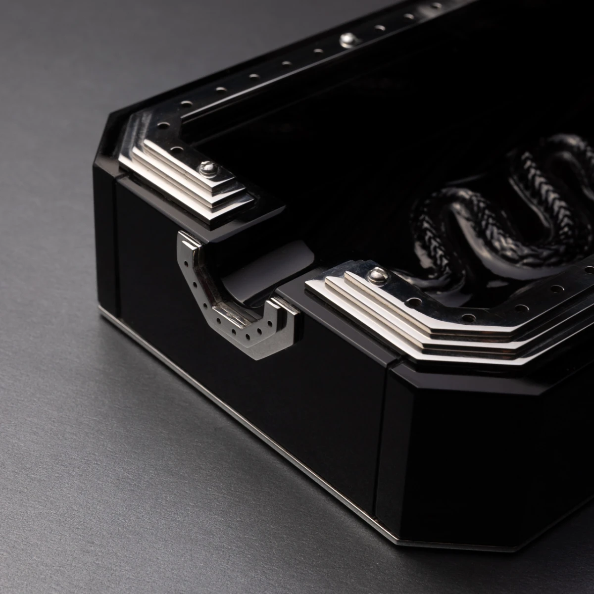 Obscura ashtray — nickel-plated steel frame detail