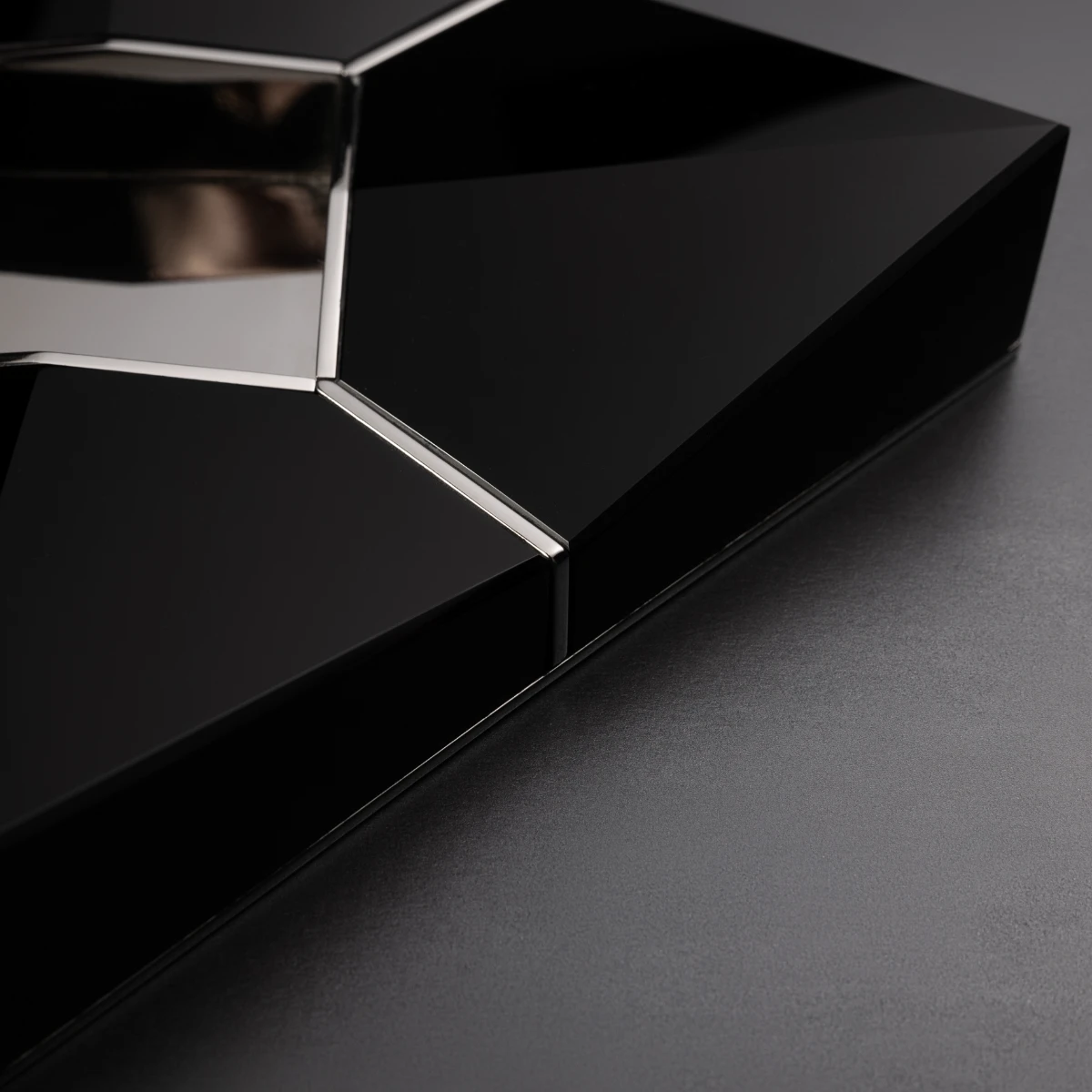 Sinatra Black obsidian ashtray — top view, faceted volcanic stone panels