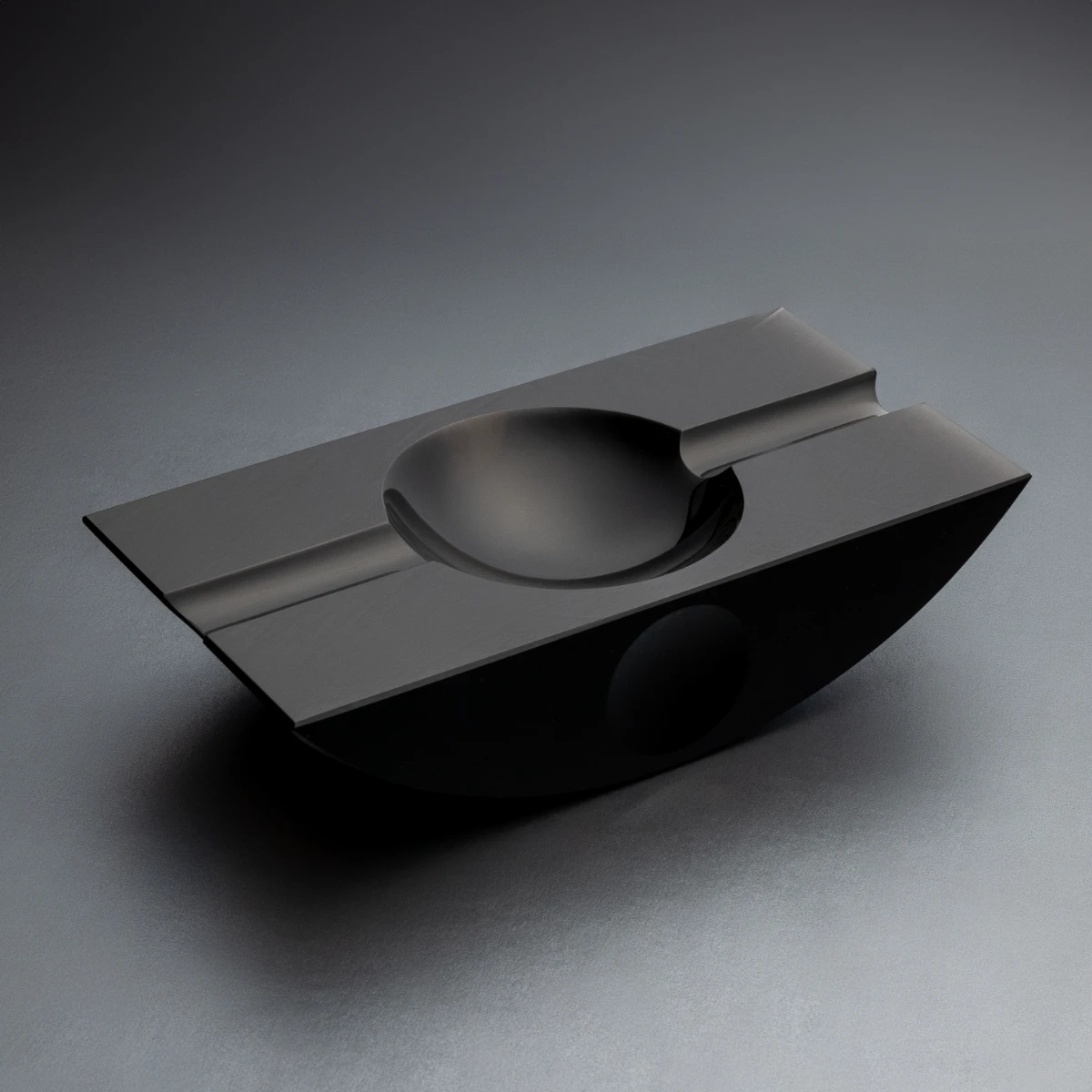 Swing obsidian cigar ashtray — curved form, Jet Black volcanic stone