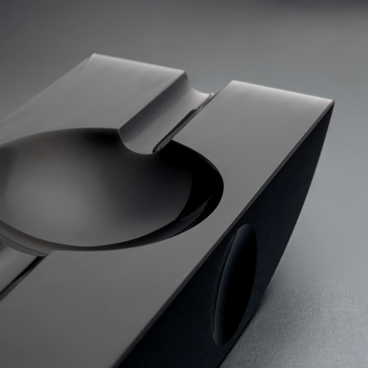 Swing ashtray — top view, circular bowl in volcanic stone