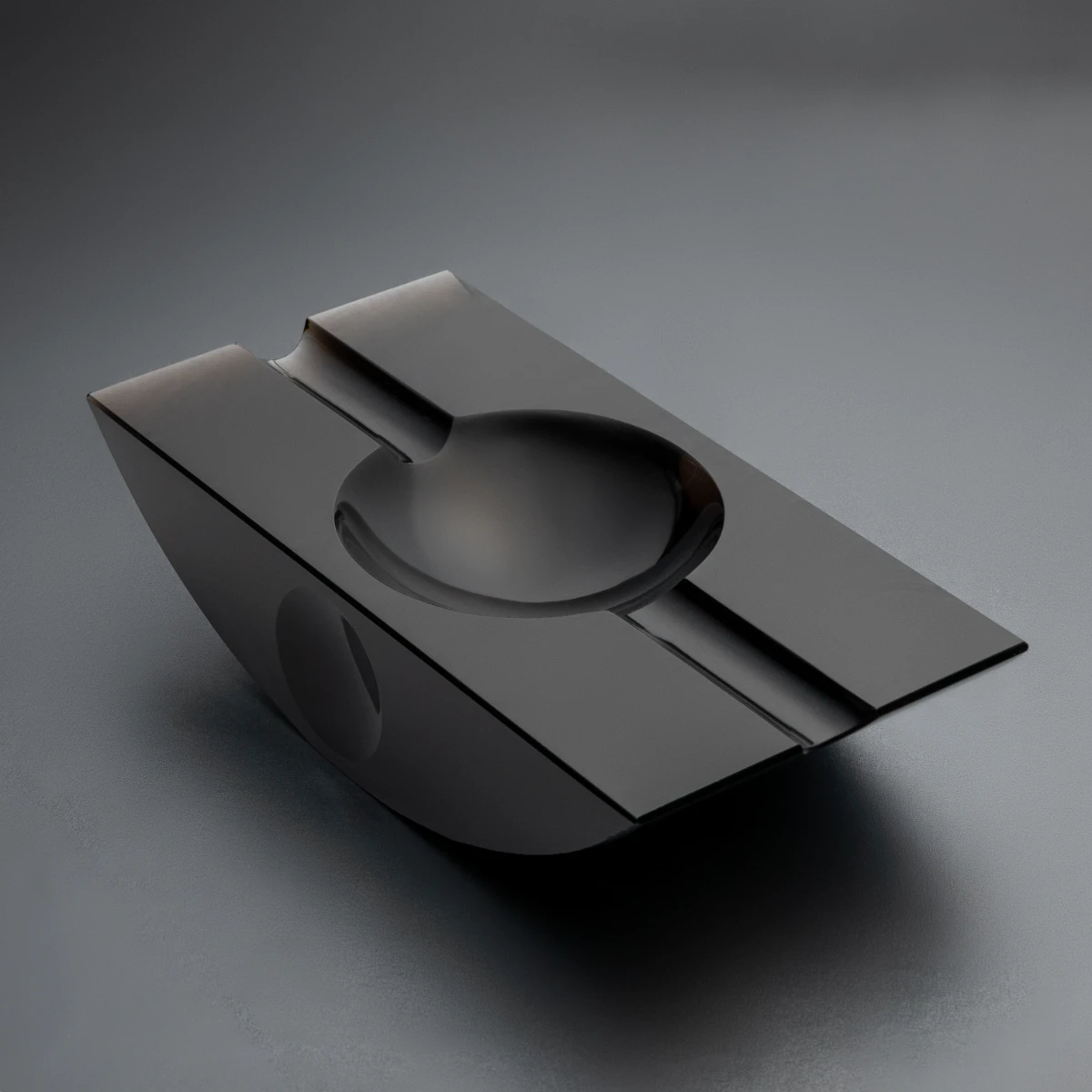Swing ashtray — angled view, single block Jet Black obsidian