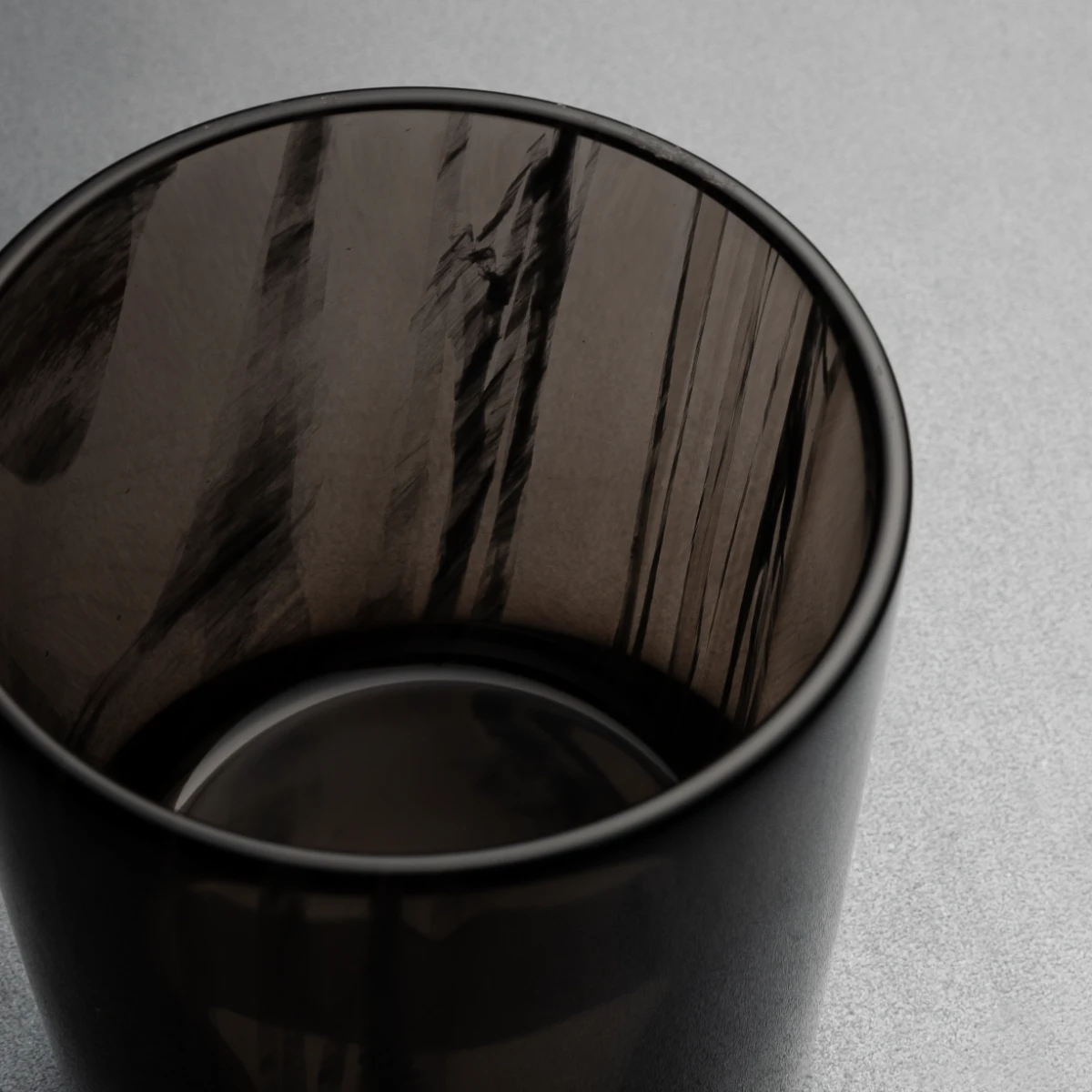 Whiskey glass — weighted flat base, obsidian tumbler detail